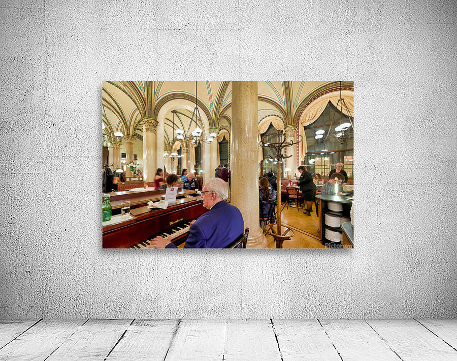Man playing piano in an ornate bustling cafe. Wall Preview