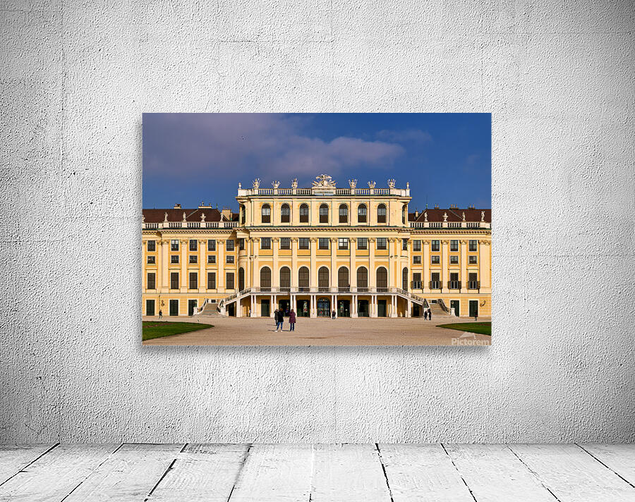 Ornate yellow palace facade with people and blue sky. Wall Preview