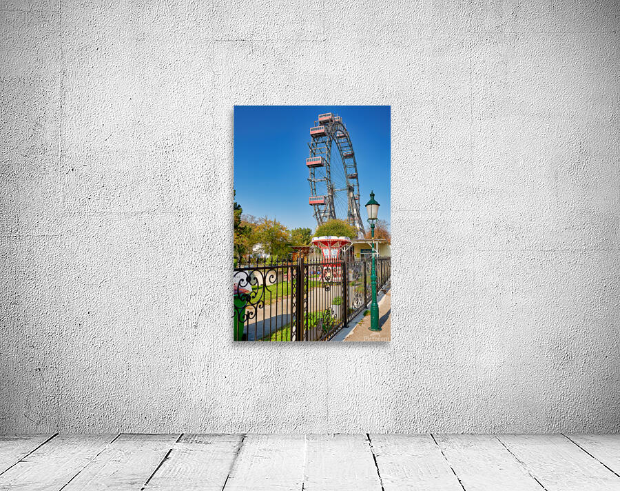 Prater Ferris wheel and carousel under a clear blue sky. Wall Preview