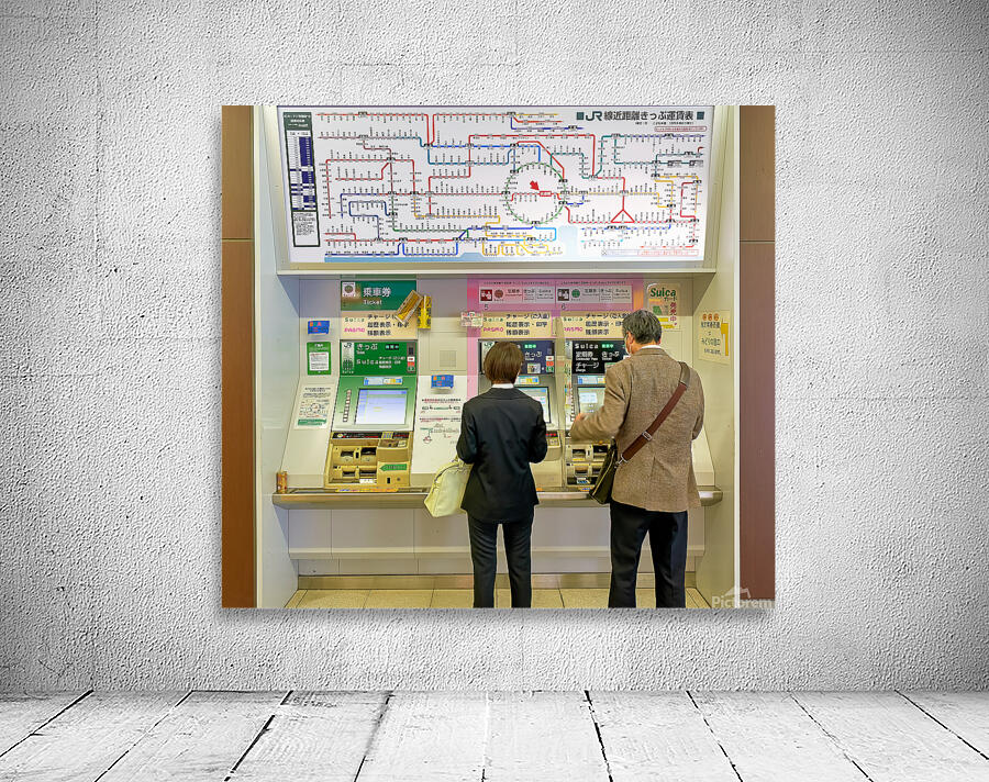 Buying tickets at a metro station in Tokyo Japan during the day Wall Preview