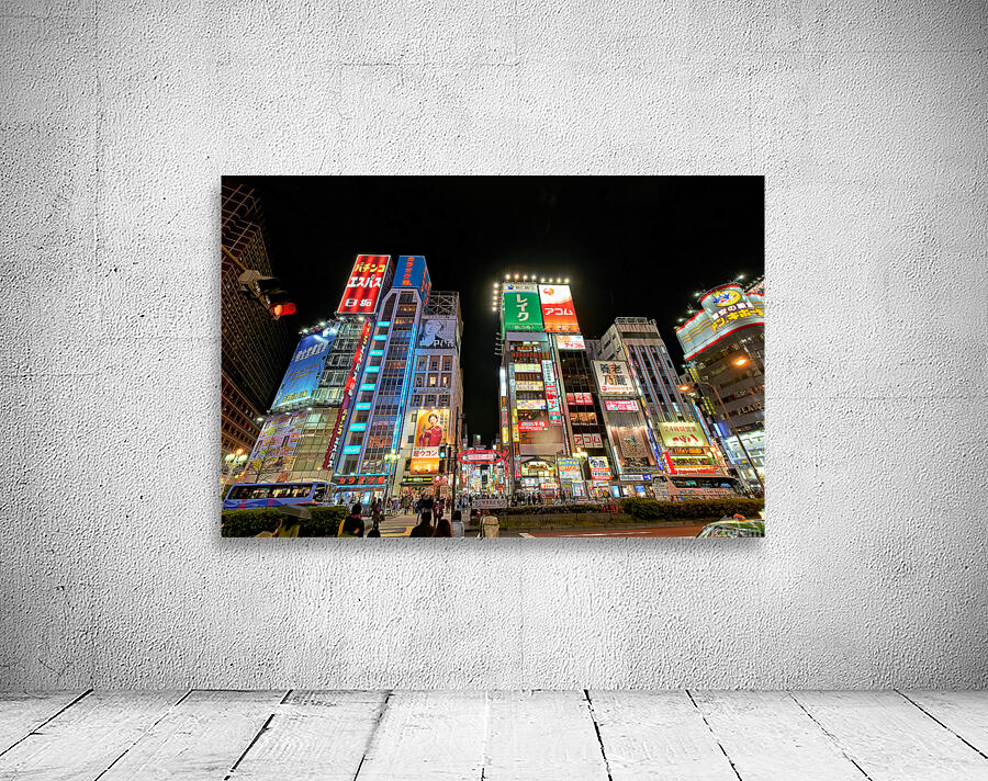 Neon lights shine bright in Shinjuku district of Tokyo at night Wall Preview