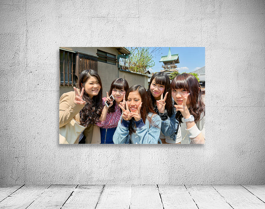 Young girls smiling in Kyoto while enjoying the day together Wall Preview