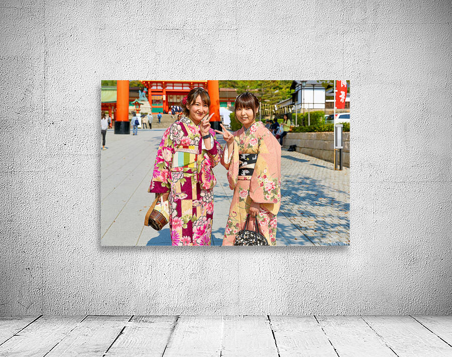Young women enjoy Fushimi Inari Taisha Shrine in Kyoto Japan Wall Preview
