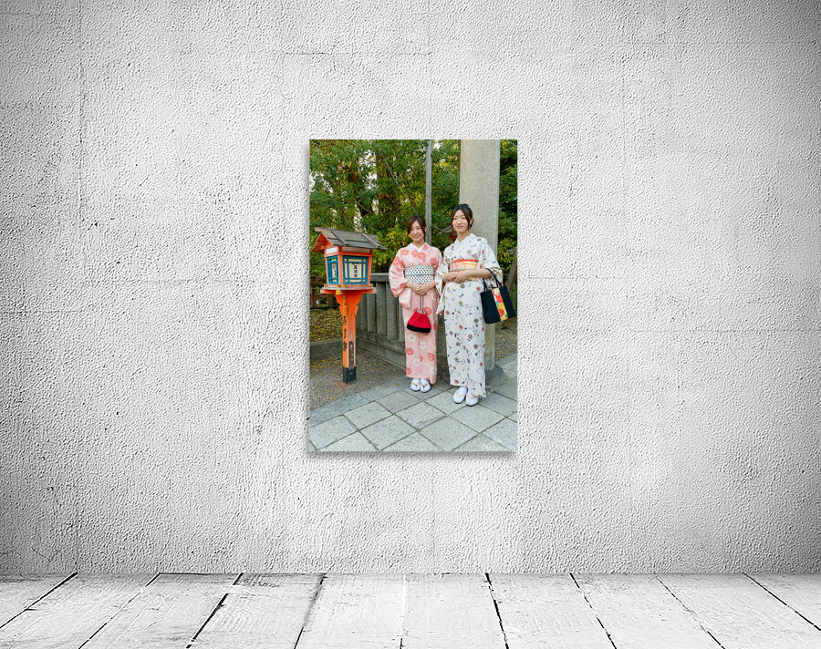 Young women in traditional kimono at Yasaka Shrine in Kyoto Wall Preview