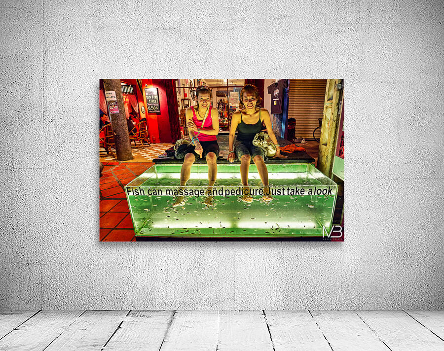 Smiling women enjoy fish foot spa. Wall Preview