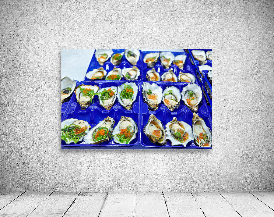Fresh oysters with garnishes in blue trays. Wall Preview