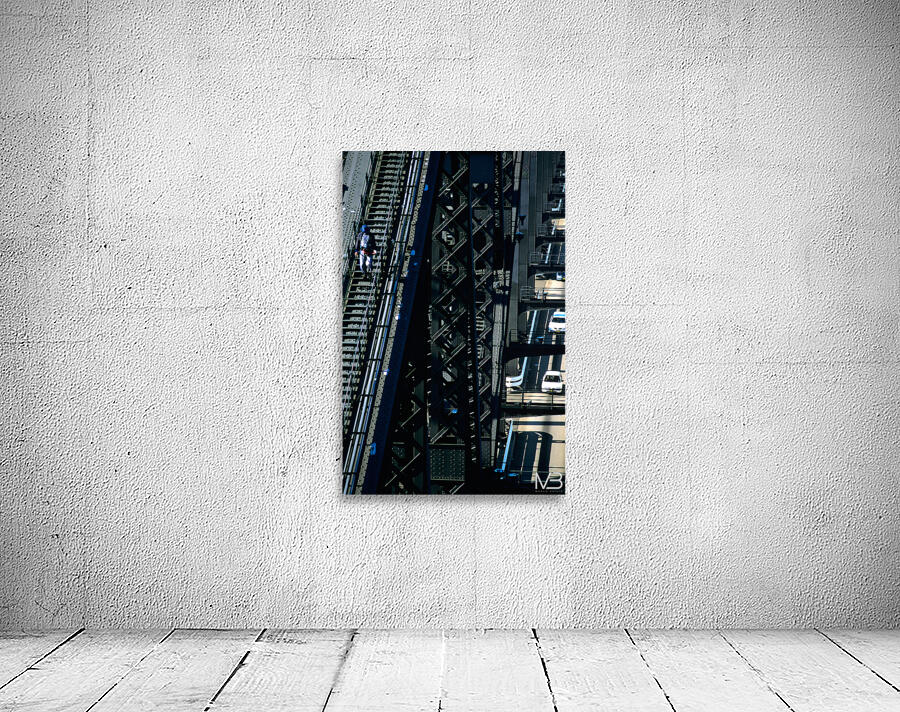 Man walks on bridge with cars below Wall Preview