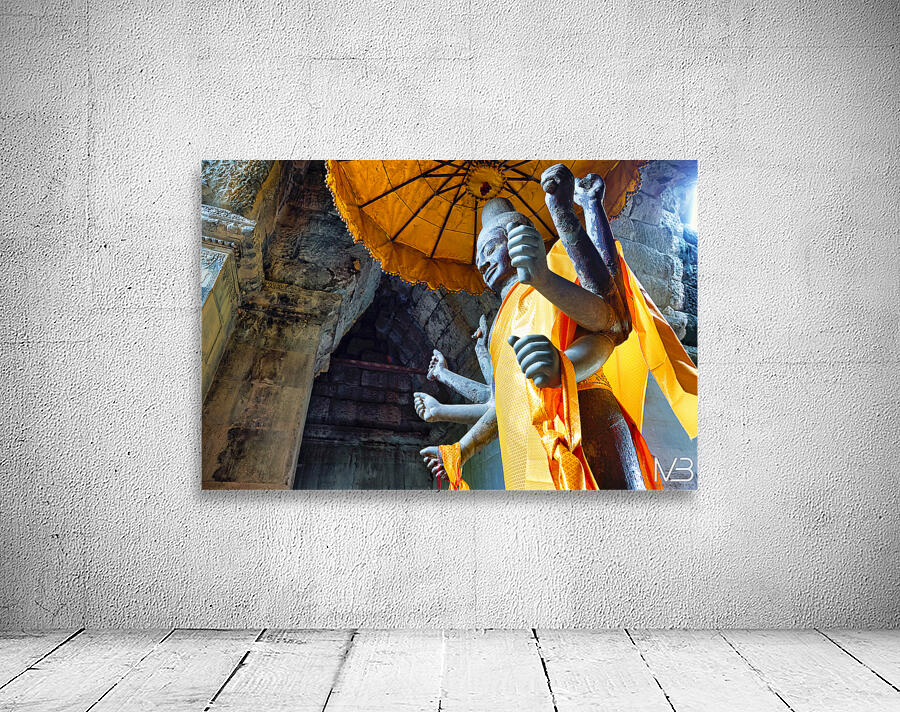 Ancient multi armed statue yellow fabric inside stone temple. Wall Preview