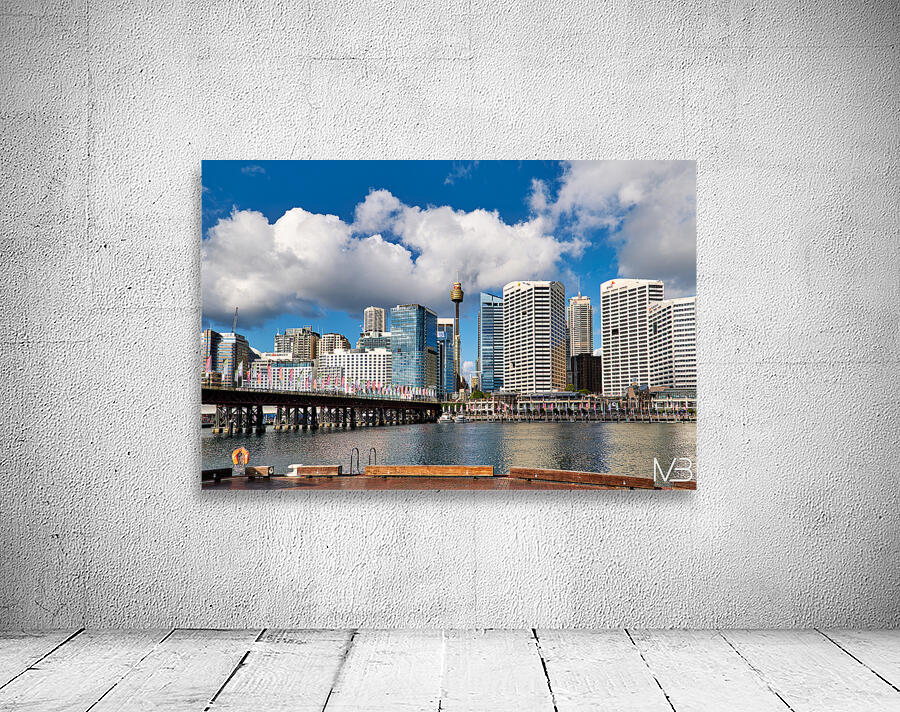Sydney Harbour skyline with bridge and buildings under clouds. Wall Preview