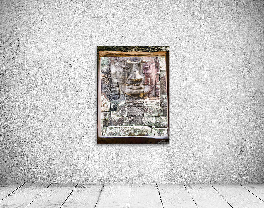 Ancient stone face carving framed in temple window. Wall Preview