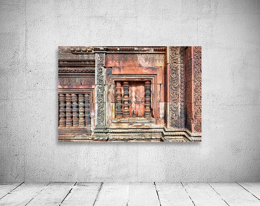 Ancient temple wall with intricate reddish stone carvings and co Wall Preview