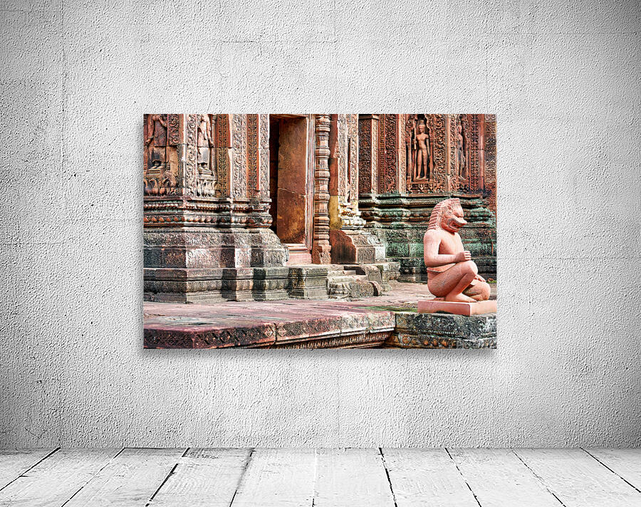 Ancient Cambodian temple with intricate carvings and guardian st Wall Preview