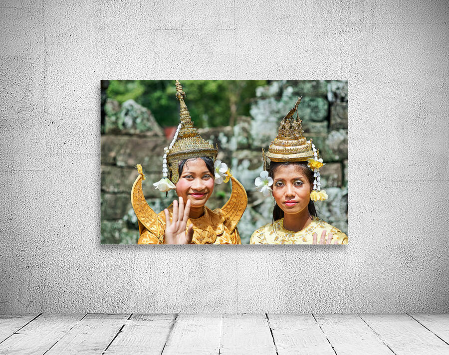 Cambodian dancers in golden attire and elaborate headwear. Wall Preview