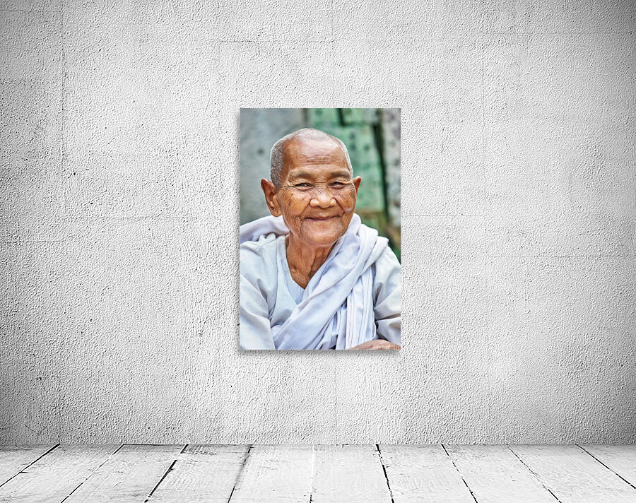Smiling elderly Asian woman in white robe. Wall Preview