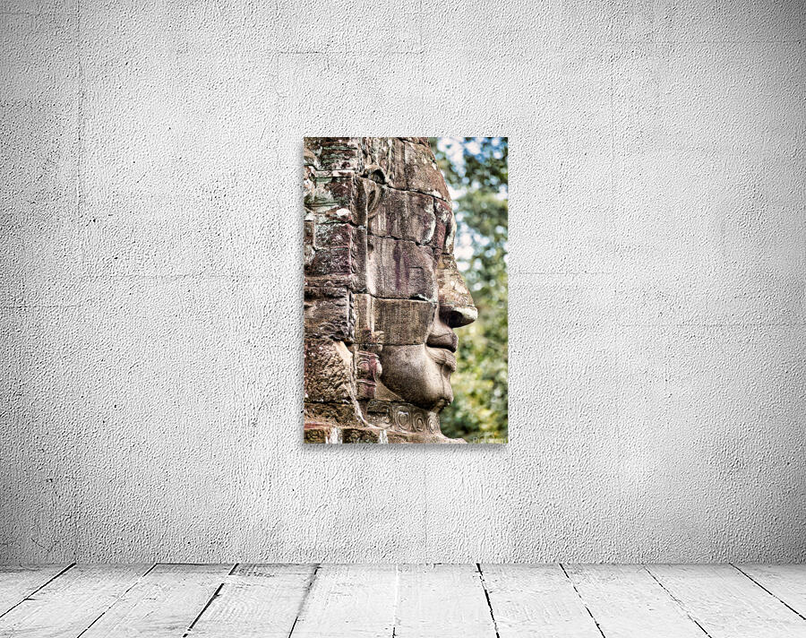 Weathered stone face carving from an ancient temple. Wall Preview