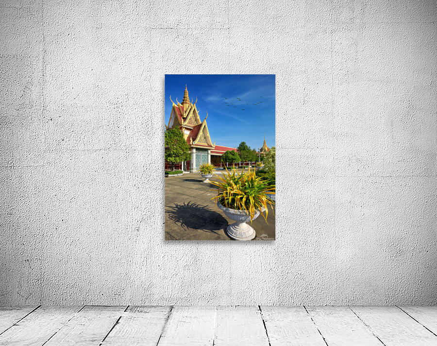 Golden temple green trees and birds under a blue sky. Wall Preview