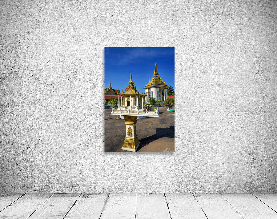 Golden shrine and temple buildings in Cambodia under blue sky. Wall Preview