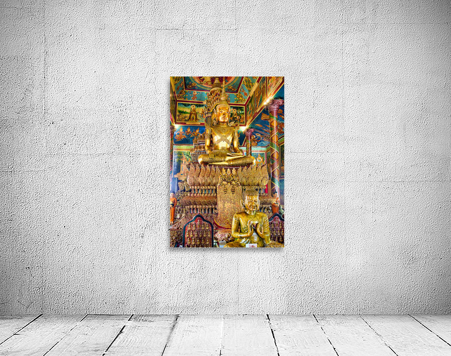 Ornate golden Buddha statue in a richly decorated temple. Wall Preview