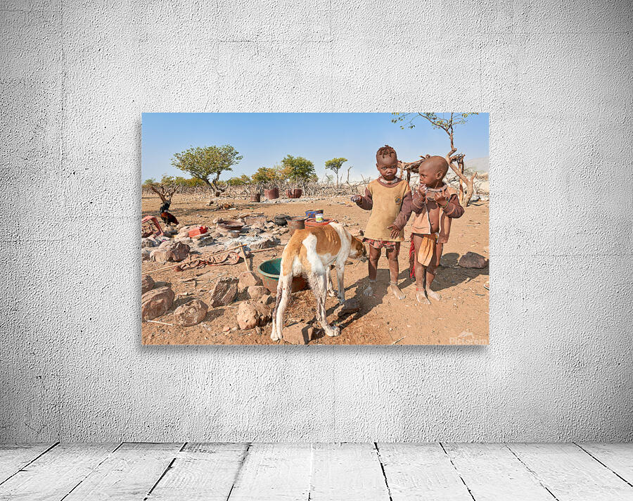 Children playing near their home in Himba Village in Namibia Wall Preview