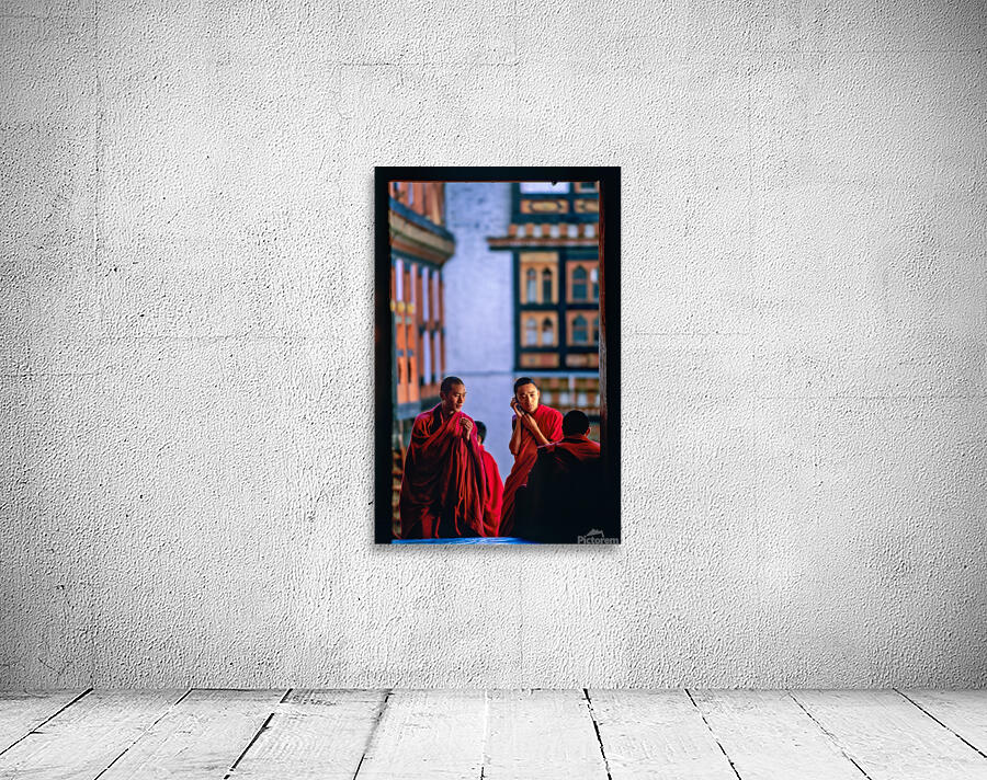 Bhutanese monks using a mobile phone. Wall Preview