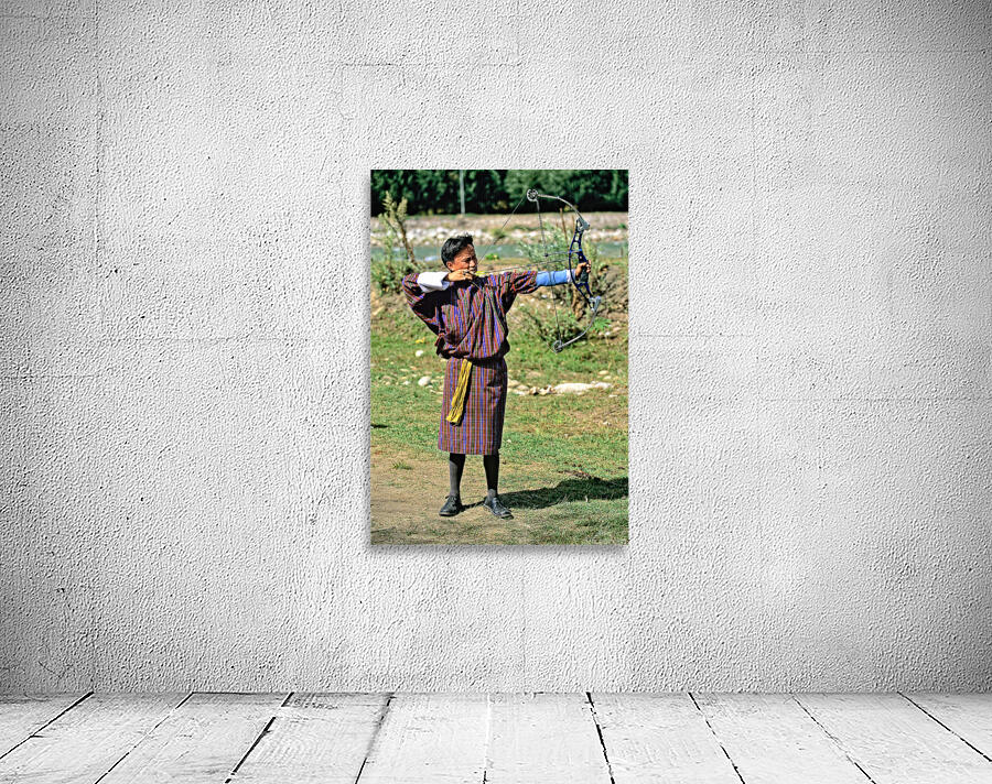 Bhutanese archer in traditional Gho aiming a compound bow. Wall Preview