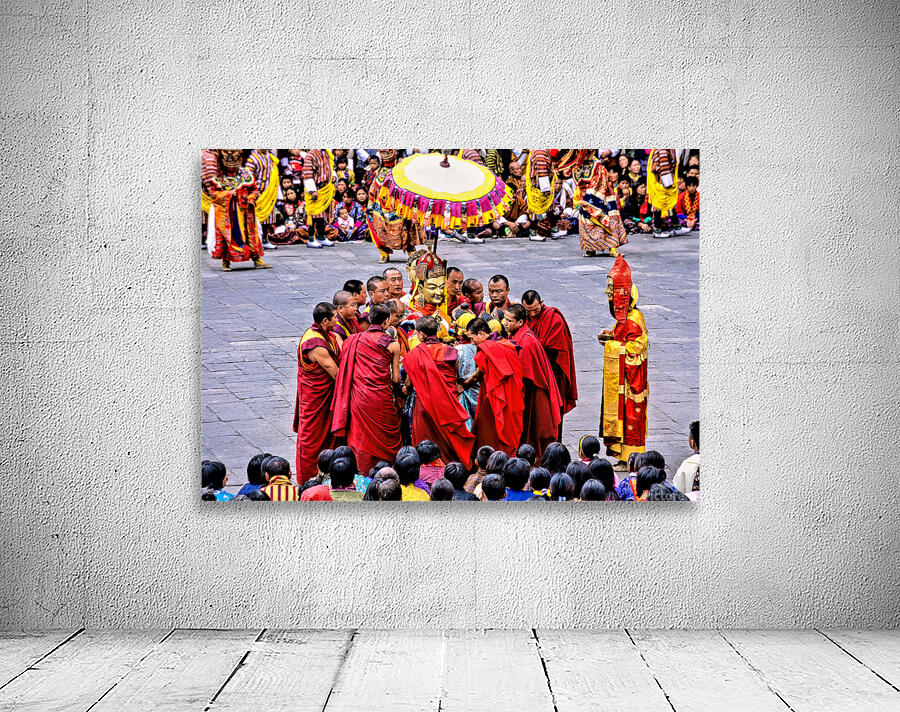 Monks in red robes gathered around a golden statue. Wall Preview