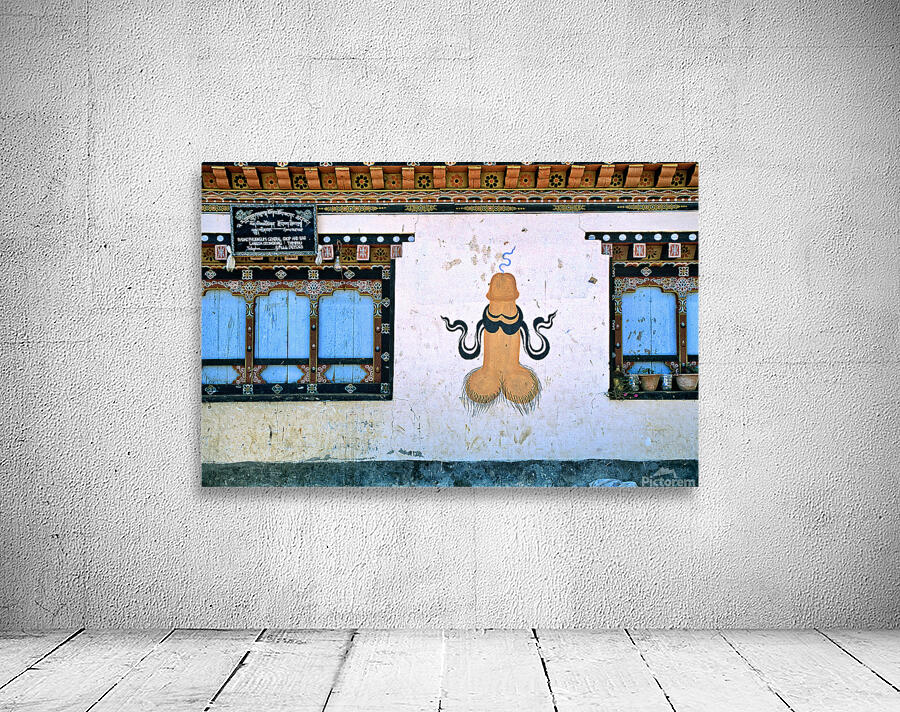Phallus painting on a building wall with windows and shop sign. Wall Preview