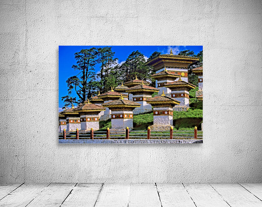 Druk Wangyal Chortens Bhutan with lush trees and blue sky. Wall Preview