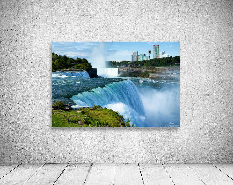 Niagara Falls with city skyline and boat. Wall Preview