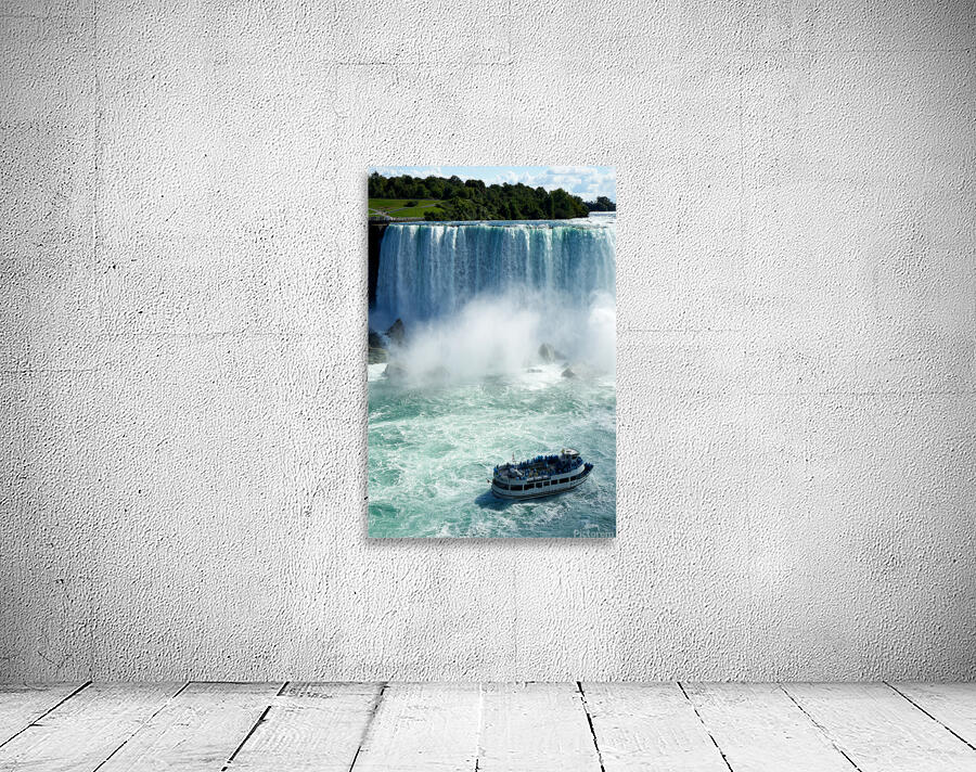 Maid of the Mist boat with tourists at Niagara Falls. Wall Preview