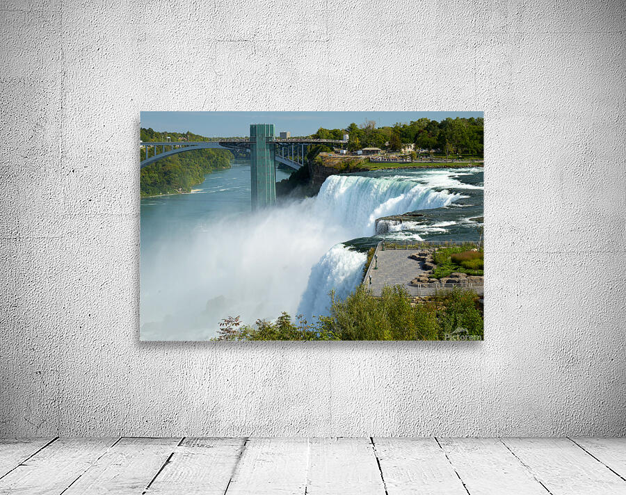 Niagara Falls bridge and observation deck on a sunny day. Wall Preview