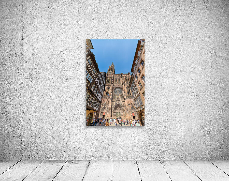 Tourists gather at Strasbourg Cathedral in Alsace on a sunny day Wall Preview