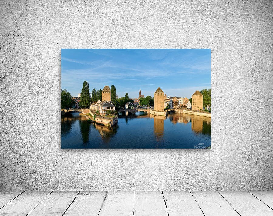 Covered bridges in Strasbourg by the river on a clear day Wall Preview