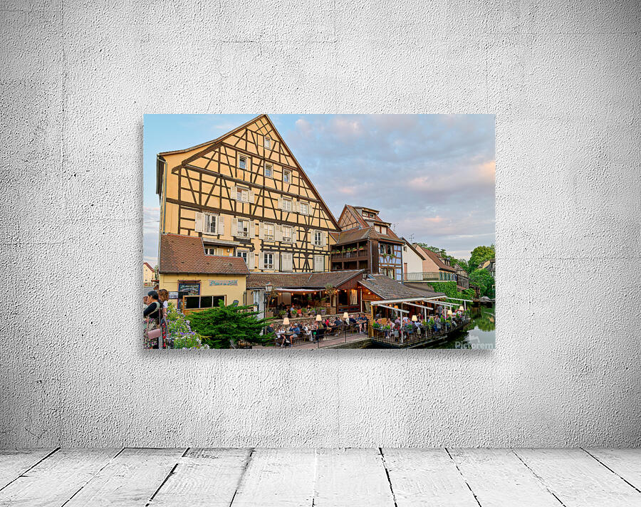 Dining by the canal in Colmar with timber framed houses in view Wall Preview