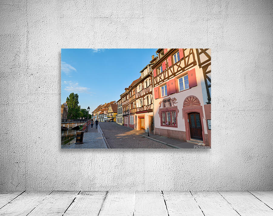 People walking along the canal in Petite Venise Colmar during ev Wall Preview