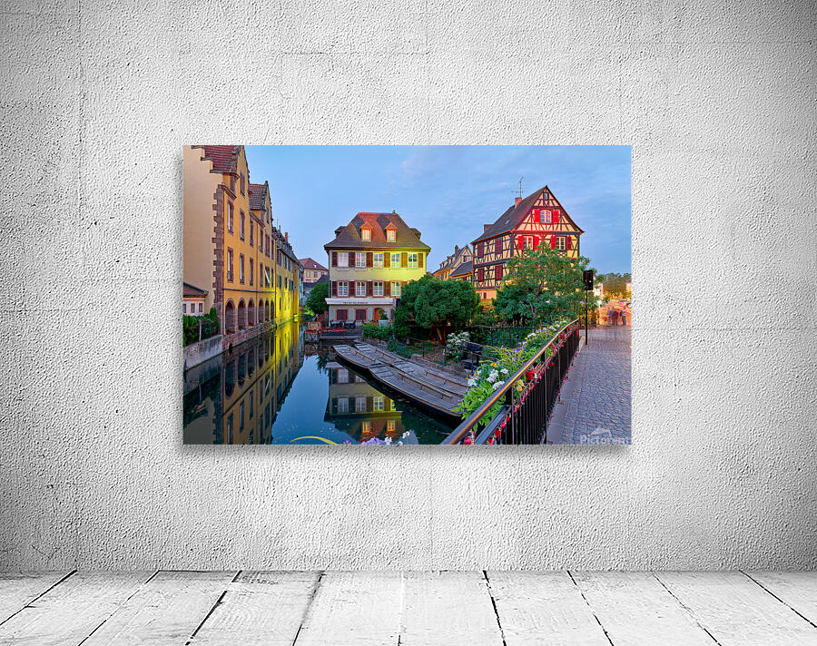 Timber framed houses and visitors in Colmar canals at dusk Wall Preview