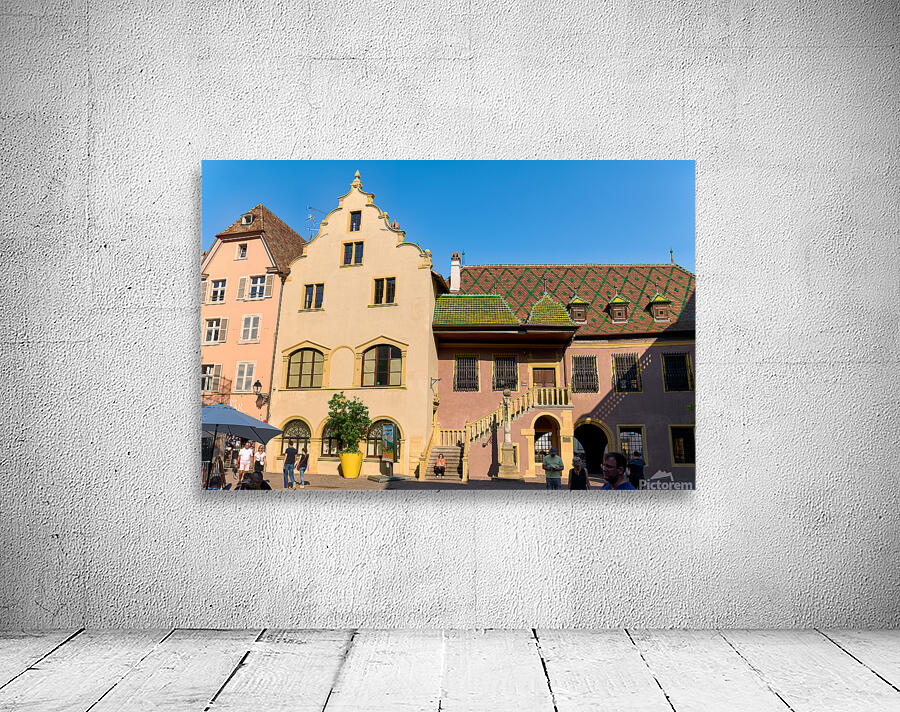 Visitors gather at Koifhus old custom house in Colmar Alsace Wall Preview