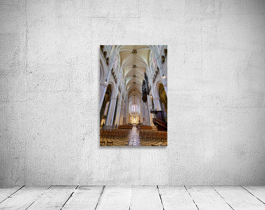 Chartres Cathedral inside with tall arches and wooden chairs Wall Preview