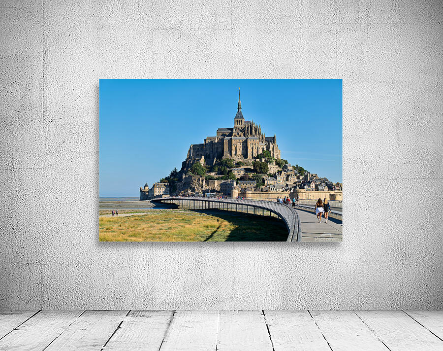 Tourists walking along the path to Mont Saint Michel in Normandy Wall Preview