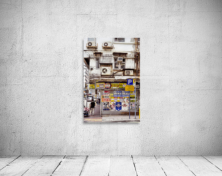 Busy street in Hong Kong shows old building and pedestrians Wall Preview