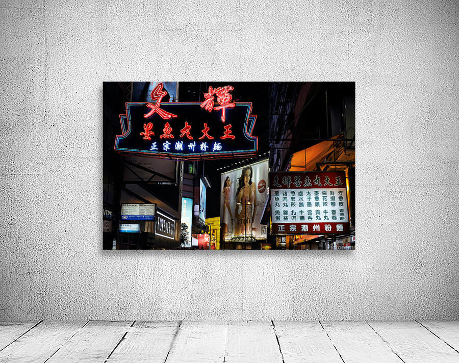 Neon signs light up a busy street in Hong Kong at night Wall Preview