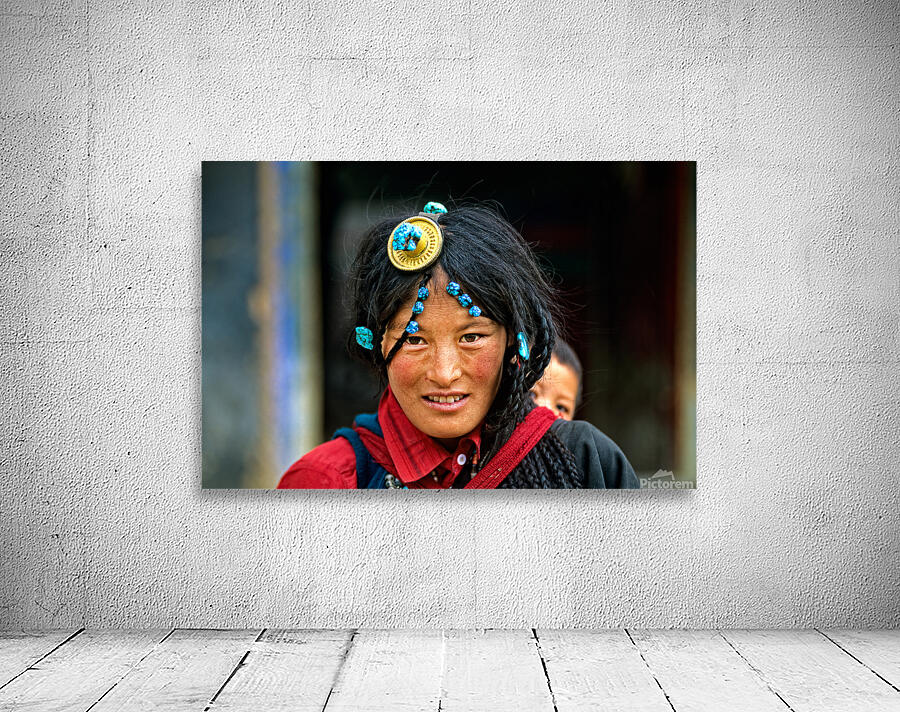 Traditional woman carries child in Tibet with ornate hair decora Wall Preview
