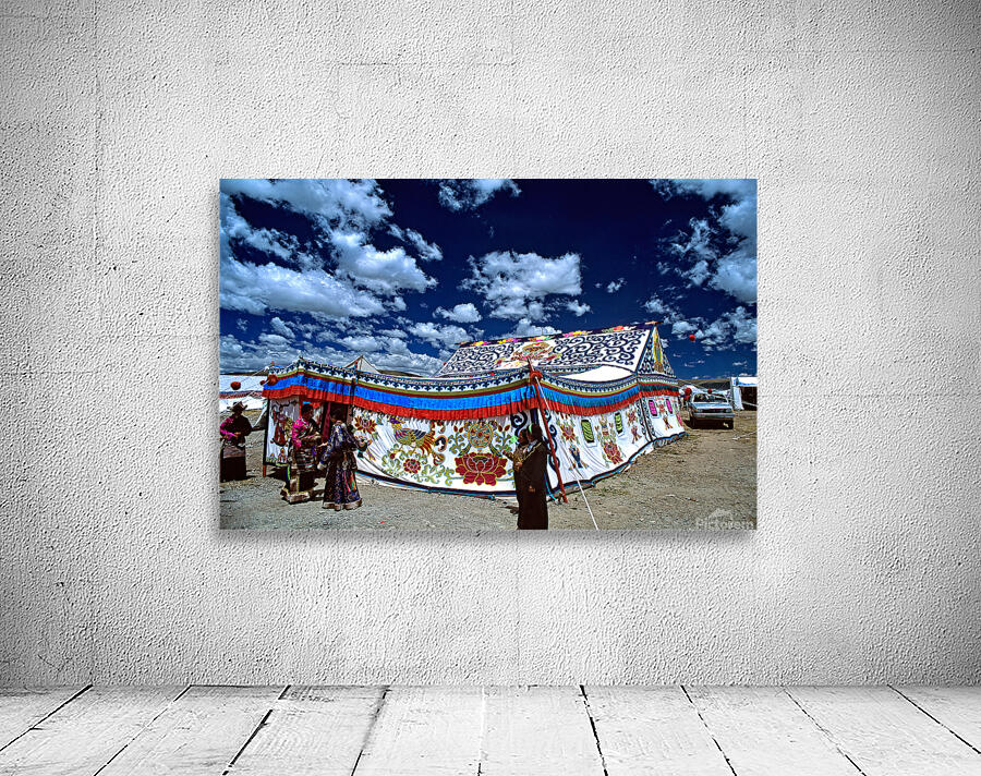 Colorful Tibetan tent with people under a cloudy sky in Tibet Wall Preview