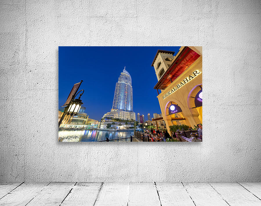 Night lights and waterfront dining in Dubai cityscape Wall Preview