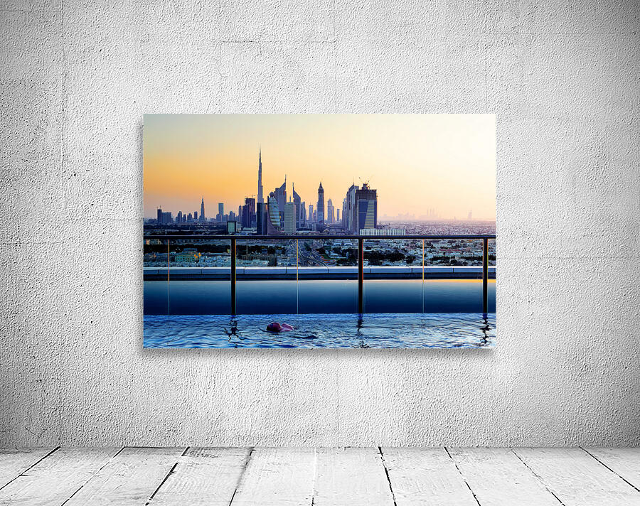 Swimming in infinity pool overlooking Dubai skyline at sunset Wall Preview