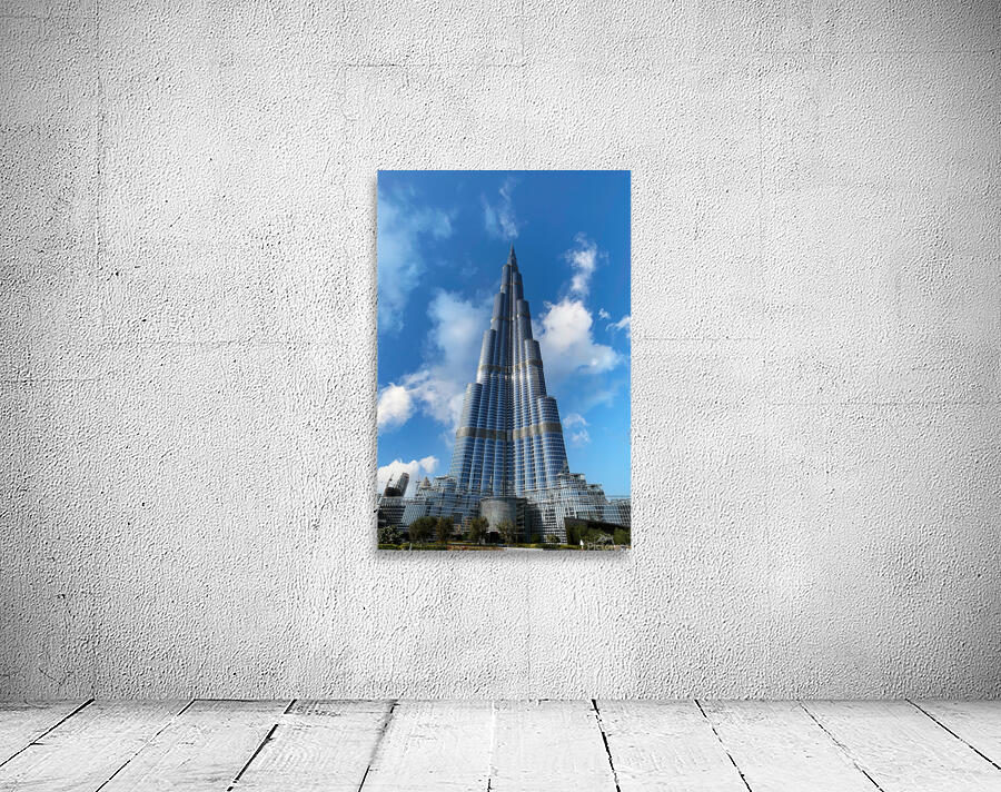 Burj Khalifa stands tall against a blue sky in Dubai UAE Wall Preview