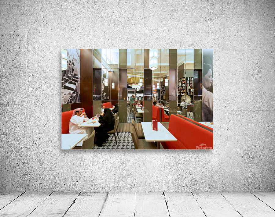 Dining in a modern restaurant with reflective walls in Dubai Wall Preview