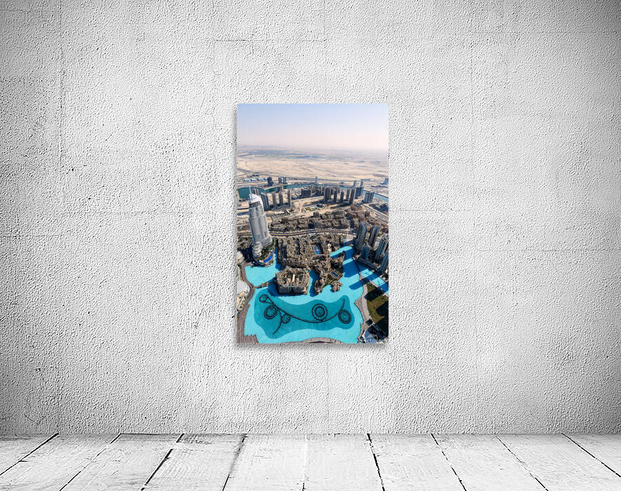 Dubai cityscape shows buildings water and desert from above Wall Preview