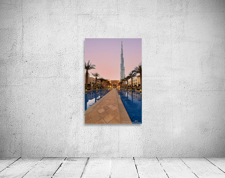 Burj Khalifa towers over pool and traditional buildings in Dubai Wall Preview