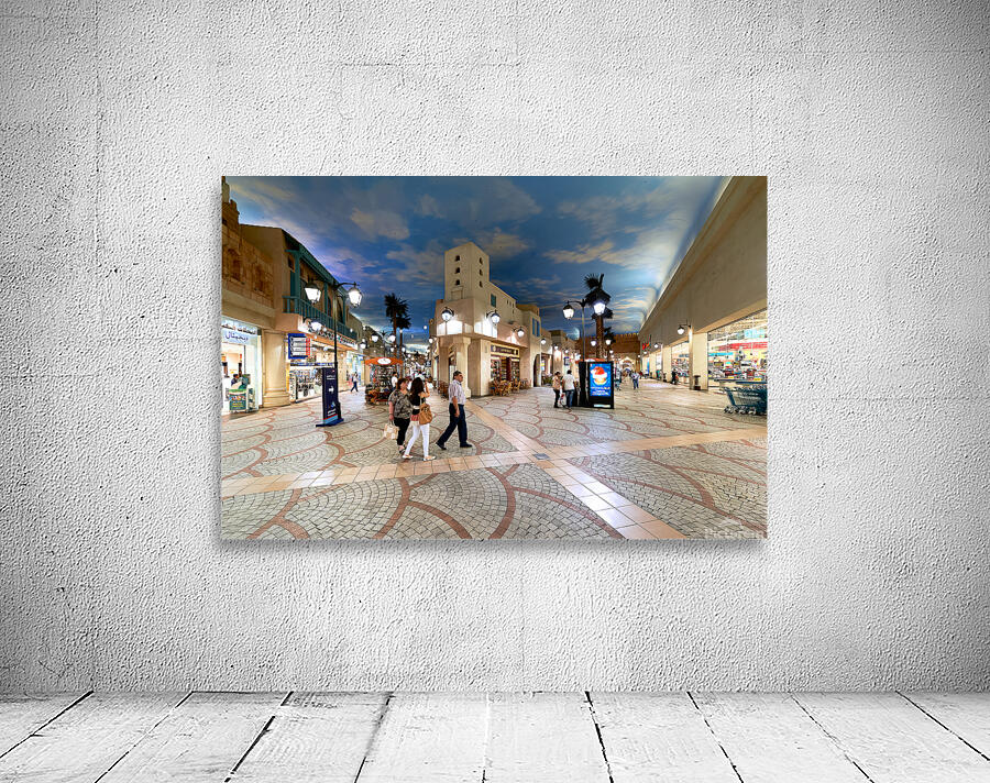 Shoppers stroll through a mall mimicking Dubais outdoor streets Wall Preview